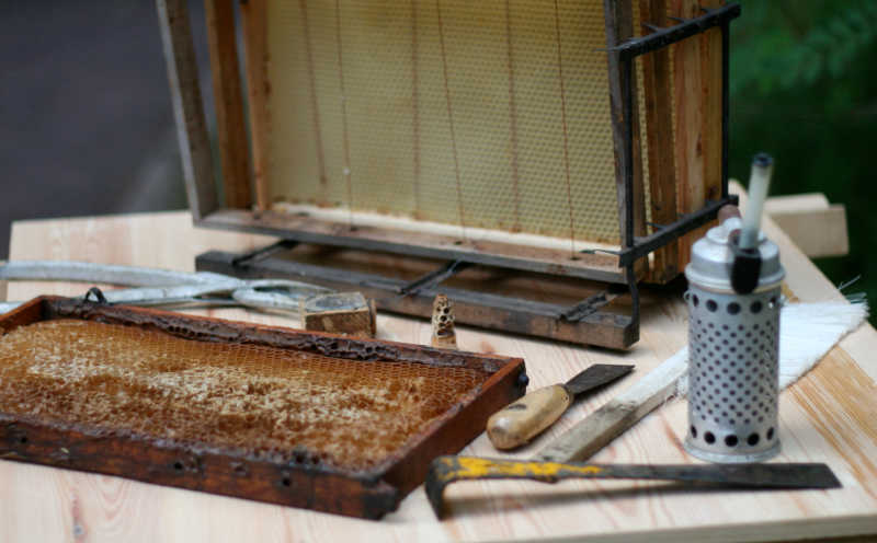 Various beekeeping supplies on a table