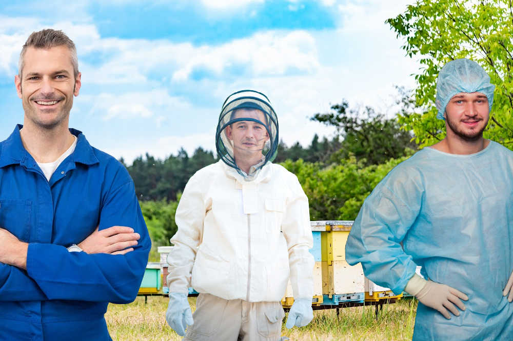 A man in a beekeeper suit next to men in coveralls and painters' suit